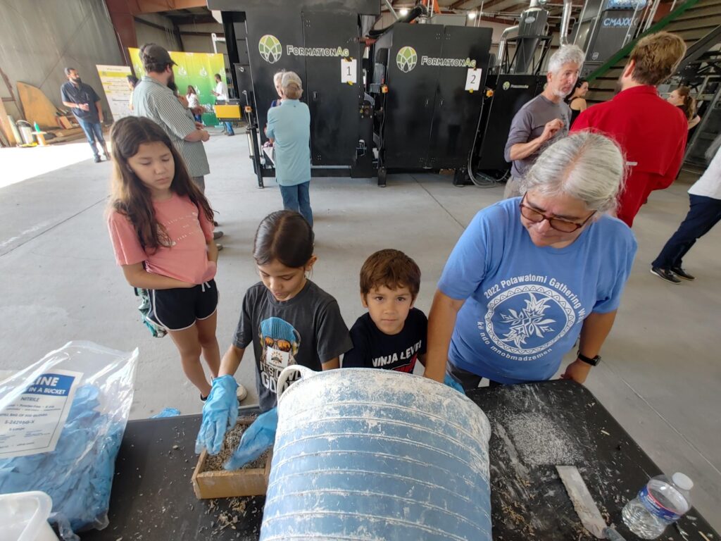 kids at open house in hemp facility